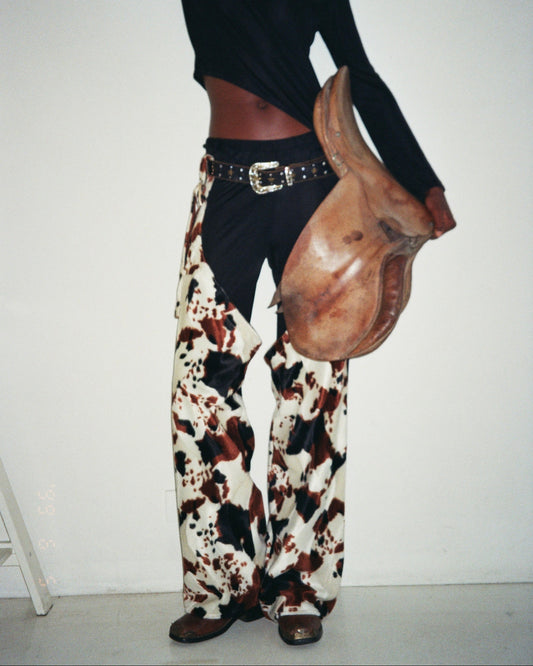 DALLAS CHAPS IN COW PATTERN FAKE FUR