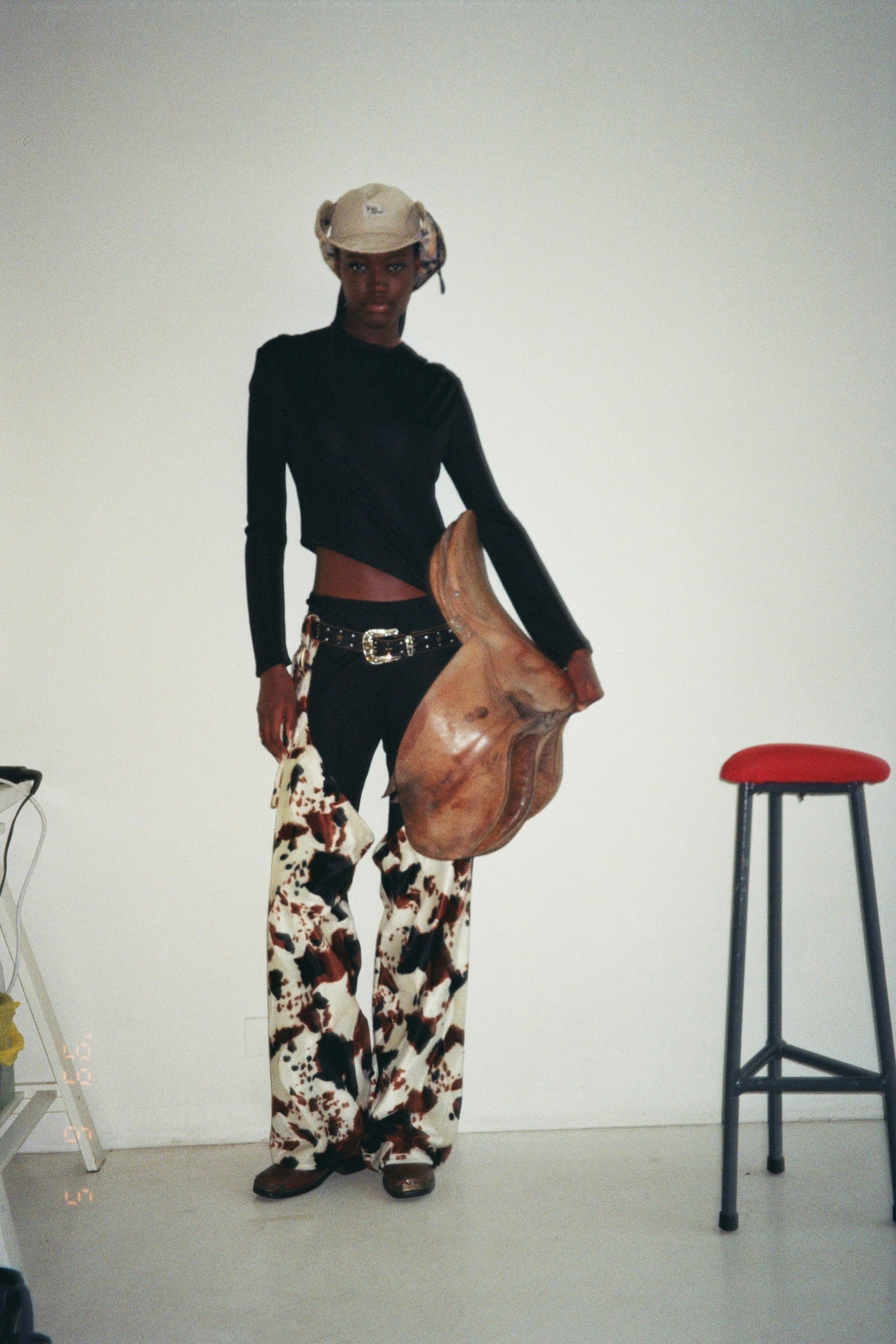 DALLAS CHAPS IN COW PATTERN FAKE FUR